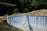 Prefabricated concrete foundation walls.